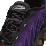 Championes Nike Air Max DN, color violeta y negro, con suela de burbujas color cobre.