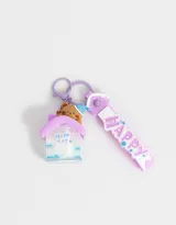 Llavero con dije de casita transparente con un oso adentro y un strap de silicona con la palabra "Happy".