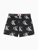 Boxer de algodón negro con estampado del logo de Calvin Klein en blanco y cintura elástica con logo en negro y rosa.