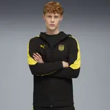 Campera deportiva con capucha Puma CAP, color negro con detalles en amarillo. Presenta cierre frontal, bolsillos laterales y logo de Puma bordado en el pecho.