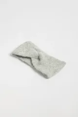 Vincha de punto color gris melange con nudo frontal.