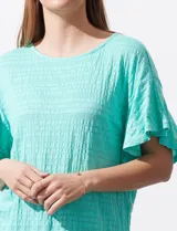 Blusa verde agua de algodón texturado, marca Ruby Rd, de manga corta con terminación amplia.