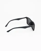 Lentes de sol rectangulares con montura de acetato color marrón oscuro (similar a madera o carey oscuro) y cristales polarizados color café.