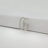 Par de aros tipo argolla de plata 925 con diseño de bolitas.