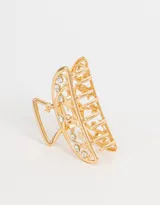 Broche dorado para el pelo con forma de media luna y apliques de strass.