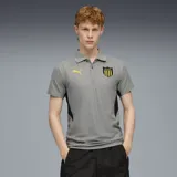 Polo gris de hombre con detalles en negro y amarillo. Logo de Puma bordado en amarillo en el pecho y escudo del Club Atlético Peñarol bordado en el pecho.