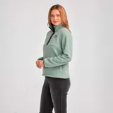 Buzo polar verde agua para mujer, con cierre de tres botones en el cuello y logo de CAT en el pecho.
