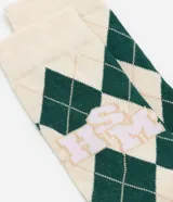 Medias de caña alta con diseño de rombos en verde y beige, y logo de High School Musical en el lateral.