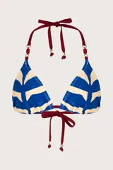 Top de bikini triángulo con estampado de rayas horizontales azules y blancas, breteles finos color bordó con cuentas rojas y detalle de bordado sutil.