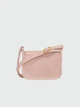 Cartera cruzada Longchamp modelo Le Foulonné, color rosa pálido, con solapa y correa ajustable.