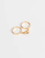 Set de dos anillos dorados con dije de corazón imantado para compartir.