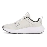 Championes Under Armour Charged Commit TR 4, color gris claro con logo negro y suela blanca.