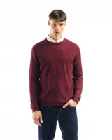 Buzo de punto color verde claro, con cuello redondo y mangas largas.