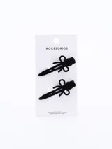 Set de dos pinzas para el pelo negras con forma de moño.