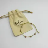 Set de tres pulseras elásticas con hilo dorado y piedras naturales de aguamarina, cuarzo rosa, amatista y piedra de la luna.