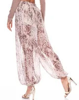 Pantalón tipo babucha con estampado animal print en tonos cálidos, cintura semi elastizada y forro interno.