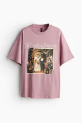 Remera rosa de corte oversized con estampado frontal de la banda de rock alternativo The Smashing Pumpkins.