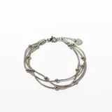 Pulsera plateada de acero con tres hilos y bolitas.