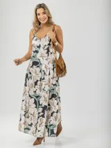 Vestido largo de tirantes finos con estampado floral en tonos beige y verde.