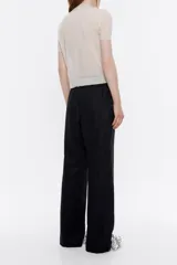 Pantalón largo negro de lino, corte jogger, con cintura ajustable con cordones y bolsillos laterales.