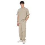 Remera color beige con logo Dickies estampado en blanco en el pecho.