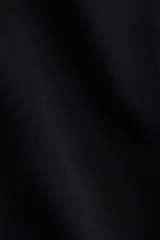 Pantalón negro de algodón, corte ancho, con cintura elástica y cordón ajustable.