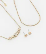 Conjunto de collar de doble cadena dorada con dije de strass y caravanas con strass.