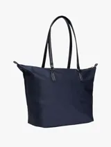 Bolso tote azul marino de nailon con cierre de cremallera, doble asa superior, bolsillo interior con cremallera, dos bolsillos interiores abiertos e insignia del monograma TH en la parte delantera.