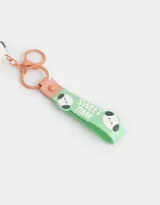 Llavero con dije de perrito apilado como helado, con strap de silicona verde con texto "Sweet Time" y mosquetón metálico.