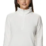 Buzo polar blanco de mujer, con cuello alto y cierre de media cremallera.
