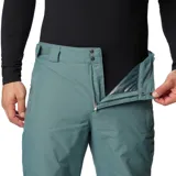 Pantalón de esquí impermeable color verde azulado con tecnología Omni-Tech y Omni-Heat Reflective. Cuenta con cintura ajustable, polaina interna y costuras selladas.