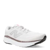 Championes New Balance Evoz V4, color blanco con detalles en gris y suela marrón.