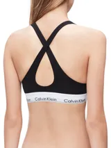 Bralette deportivo negro de algodón modal, con copas sin costuras con relleno, tiras cruzadas en la espalda y banda inferior elástica blanca con logo de Calvin Klein.