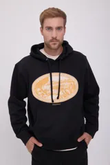 Hoodie negro con capucha y manga larga, de corte holgado y estampado ovalado en el pecho.