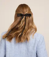 Set de dos pinzas para el pelo con moña de poliéster.