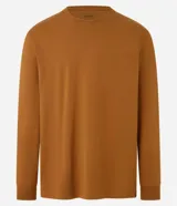 Remera de manga larga color blanco, confeccionada en algodón, con cuello redondo y puños ajustados.