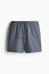 Short gris de lona de algodón, con cintura elástica ajustable con cordón, bolsillos laterales y bolsillo trasero.