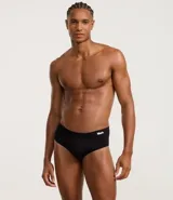 Calzoncillo slip blanco de poliamida con cintura elástica y logo Mash en negro.