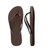 Sandalias Havaianas Slim Glitter II color beige con tiras finas con glitter dorado.