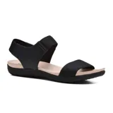 Sandalias bajas negras con ajuste elástico en el tobillo y plantilla color beige.