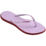 Ojotas Havaianas Slim Point color crema con contorno verde oscuro y logo en las tiras.