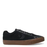 Championes Converse Sport Casual OX negros con suela marrón de goma.