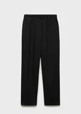 Pantalón negro de lino con cintura elástica y cordón ajustable.