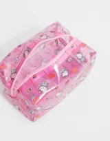 Cartuchera de PVC transparente con estampado de Hello Kitty, detalles de glitter y cierre superior con tirador de silicona.