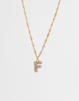 Cadena corta dorada con dije de la letra A cubierto de strass.