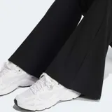 Calza acampanada negra de tejido de canalé con cintura elástica y logo Adidas bordado en blanco.