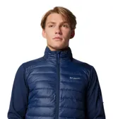 Chaqueta híbrida Columbia para hombre, color azul marino, con cuerpo acolchado y mangas de softshell. Presenta cierre frontal completo, cuello alto y logo de Columbia en el pecho.