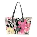 Bolso tipo shopper de PU con estampado de cebra, flores y lunares en tonos rosa, amarillo, negro y blanco. Tiene doble asa de hombro negra y cierre abierto. Incluye un bolsillo interno con cierre.