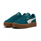Championes Puma Palermo Elevata, color negro con franja blanca y suela marrón.