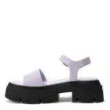 Sandalias con plataforma color lila, con tira ancha sobre el empeine y tobillera con hebilla metálica.